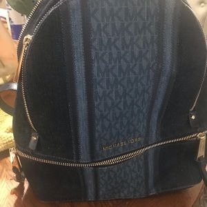 Used  Denim Michael Kors backpack purse.